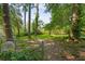 View of backyard surrounded by mature trees at 1876 Madrona Street Nw St, Atlanta, GA 30318