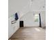 Bright bedroom featuring fresh paint, arched window, and new flooring at 1876 Madrona Street Nw St, Atlanta, GA 30318
