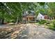 Charming bungalow with a front porch and mature trees at 1876 Madrona Street Nw St, Atlanta, GA 30318