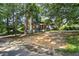 Classic bungalow-style home nestled among mature trees at 1876 Madrona Street Nw St, Atlanta, GA 30318