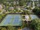 Aerial view features the tennis courts and gazebo area, surrounded by lush greenery and beautiful landscaping at 6430 Banbury Se Ct, Mableton, GA 30126