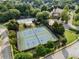 Aerial view features the tennis courts and gazebo area, surrounded by lush greenery and beautiful landscaping at 6430 Banbury Se Ct, Mableton, GA 30126