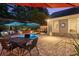 Tranquil backyard oasis features a pool, lounge seating, dining area, and ambient lighting at 6430 Banbury Se Ct, Mableton, GA 30126
