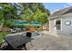 Backyard pool surrounded by comfortable outdoor seating, shade umbrellas, and professional landscaping at 6430 Banbury Se Ct, Mableton, GA 30126