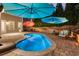 Backyard pool area features a pool, outdoor seating, two umbrellas and lovely landscaping at 6430 Banbury Se Ct, Mableton, GA 30126