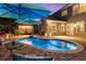 Inviting backyard pool with outdoor seating, a covered pergola and manicured landscaping at 6430 Banbury Se Ct, Mableton, GA 30126