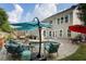 Relaxing backyard with a stone patio, lounge seating, in-ground pool, and a gray house exterior at 6430 Banbury Se Ct, Mableton, GA 30126