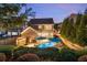 Beautiful backyard with a pool, patio, pergola, and lush landscaping for ultimate outdoor enjoyment at 6430 Banbury Se Ct, Mableton, GA 30126