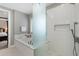 Modern bathroom featuring a walk-in shower, soaking tub, and neutral decor at 6430 Banbury Se Ct, Mableton, GA 30126