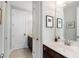 Well-lit bathroom featuring modern fixtures, dark wood cabinets, and neutral colored walls at 6430 Banbury Se Ct, Mableton, GA 30126