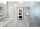 Modern bathroom featuring a double vanity, walk-in shower, soaking tub, and closet at 6430 Banbury Se Ct, Mableton, GA 30126