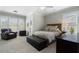 This primary bedroom features a spacious layout and a large window for lots of natural light at 6430 Banbury Se Ct, Mableton, GA 30126