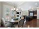 Bright dining area with a round table, four chairs, and open access to the kitchen and living spaces at 6430 Banbury Se Ct, Mableton, GA 30126