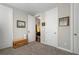Hallway with neutral decor, carpet, storage furniture, and access to other rooms at 6430 Banbury Se Ct, Mableton, GA 30126