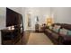 Comfortable living room with a large TV and view of the hallway at 6430 Banbury Se Ct, Mableton, GA 30126