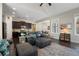 Inviting living room with dark wood floors, dark cabinetry, and comfortable seating at 6430 Banbury Se Ct, Mableton, GA 30126
