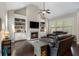 Living room features include vaulted ceilings, built-in shelving, a fireplace, hardwood floors, and large windows at 6430 Banbury Se Ct, Mableton, GA 30126
