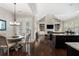 Open-concept living space with hardwood floors, fireplace, built-in shelving, and a breakfast nook at 6430 Banbury Se Ct, Mableton, GA 30126