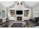 Living room features include vaulted ceilings, built-in shelving, a fireplace, hardwood floors, and a large leather sofa at 6430 Banbury Se Ct, Mableton, GA 30126