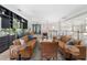 Open-concept living space with two large couches, wood accent tables, and hardwood floors at 6430 Banbury Se Ct, Mableton, GA 30126