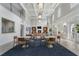 Bright lounge area with fireplace, TV, high ceilings, and modern decor at 6430 Banbury Se Ct, Mableton, GA 30126