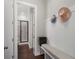 Functional mud room with a bench, hooks for coats, and access to the bathroom at 6430 Banbury Se Ct, Mableton, GA 30126