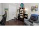 Stylish home office with a comfortable chair, storage, and artistic decor at 6430 Banbury Se Ct, Mableton, GA 30126