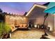 Outdoor living space featuring a covered pergola with string lights and comfortable seating at 6430 Banbury Se Ct, Mableton, GA 30126