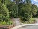 Park entrance with wooden fence and gravel path at 6430 Banbury Se Ct, Mableton, GA 30126