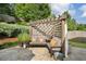 Stone patio with an outdoor living area under a pergola covered with a privacy screen at 6430 Banbury Se Ct, Mableton, GA 30126