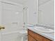 Bathroom featuring a shower-tub combo, a vanity with sink, and a mirror at 100 Walnut Ct, Stockbridge, GA 30281