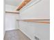 Walk-in closet featuring neutral carpet, white walls and wood shelving at 100 Walnut Ct, Stockbridge, GA 30281