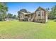 Inviting single-story home features a lush green lawn and attractive exterior details at 100 Walnut Ct, Stockbridge, GA 30281
