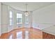 Bright kitchen featuring wood floors, large windows, and adjacent breakfast nook at 100 Walnut Ct, Stockbridge, GA 30281