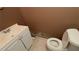 Modest bathroom with white vanity and standard toilet, ready for renovation at 1095 Mitchell Crossing Sw Dr, Atlanta, GA 30331