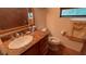 Bathroom featuring a tile counter, sink, mirror, and toilet at 1095 Mitchell Crossing Sw Dr, Atlanta, GA 30331