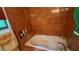 An inviting bathroom with jacuzzi tub features unique patterned tile at 1095 Mitchell Crossing Sw Dr, Atlanta, GA 30331