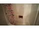 Modern bathtub with a stylish curtain, perfect for a relaxing bath at 1095 Mitchell Crossing Sw Dr, Atlanta, GA 30331