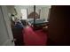 Bedroom with a four-poster bed, red carpet, and classic furnishings at 1095 Mitchell Crossing Sw Dr, Atlanta, GA 30331