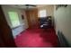 Bedroom with an ironing board and desk at 1095 Mitchell Crossing Sw Dr, Atlanta, GA 30331