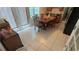 Bright dining room with tiled floors, table, chairs, and natural light at 1095 Mitchell Crossing Sw Dr, Atlanta, GA 30331