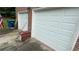 Double garage doors on a brick home with bags of mulch at 1095 Mitchell Crossing Sw Dr, Atlanta, GA 30331