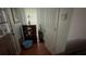 Hallway with hardwood floors and a view of a cabinet and an upright vacuum at 1095 Mitchell Crossing Sw Dr, Atlanta, GA 30331