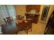 Eat-in kitchen featuring wooden table and chairs, wood cabinets and tile floors at 1095 Mitchell Crossing Sw Dr, Atlanta, GA 30331