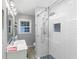 Cozy bathroom featuring modern vanity and enclosed shower with elegant tile design and modern fixtures at 2123 Garden Cir, Decatur, GA 30032
