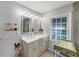 Bright bathroom featuring a dual vanity with modern fixtures and ample counter space, plus a window at 2123 Garden Cir, Decatur, GA 30032
