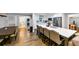 Modern kitchen with stainless steel appliances, a large island with bar seating and an adjacent dining area at 2123 Garden Cir, Decatur, GA 30032