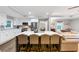 Contemporary kitchen featuring stainless steel appliances, an island with seating, and open to the living area at 2123 Garden Cir, Decatur, GA 30032