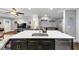 Spacious kitchen island with sink, seating, and stainless steel dishwasher at 2123 Garden Cir, Decatur, GA 30032
