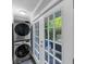 Convenient laundry area with stacked washer and dryer near outdoor access at 2123 Garden Cir, Decatur, GA 30032